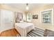 Bright bedroom with hardwood floors, a neutral palette, and cozy decor at 3529 Trent St, Charlotte, NC 28209