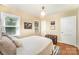 Another view of the bedroom with windows and decor at 3529 Trent St, Charlotte, NC 28209