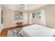 Clean and well-lit bedroom with hardwood flooring and large window at 3529 Trent St, Charlotte, NC 28209