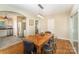 Cozy dining room with hardwood floors, modern lighting, and an open layout into the kitchen at 3529 Trent St, Charlotte, NC 28209