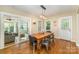 Charming dining room with hardwood floors, slider doors to the living room, and a stylish light fixture at 3529 Trent St, Charlotte, NC 28209