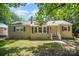 Charming one-story home with a brick exterior, inviting front porch, and a well-maintained lawn at 3529 Trent St, Charlotte, NC 28209