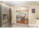 Open-concept kitchen with stainless steel refrigerator, open to dining area and living room at 3529 Trent St, Charlotte, NC 28209