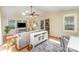 Inviting living room with skylights, lots of light, and access to the kitchen and back yard at 3529 Trent St, Charlotte, NC 28209