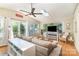 Bright living room with skylight, fan, and access to the outside patio at 3529 Trent St, Charlotte, NC 28209