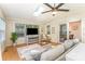 Inviting living room with a skylight, a ceiling fan, large windows, and a sliding glass door at 3529 Trent St, Charlotte, NC 28209
