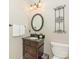 Half bathroom with a granite vanity and traditional fixtures at 3721 Providence Plantation Ln, Charlotte, NC 28270