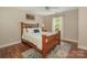 Bedroom with ceiling fan, hardwood floors, and large window at 3721 Providence Plantation Ln, Charlotte, NC 28270