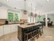 Spacious eat-in kitchen with granite countertops, stainless appliances, and a breakfast bar at 3721 Providence Plantation Ln, Charlotte, NC 28270