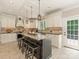 Well-equipped kitchen with a center island, dark granite countertops and white cabinetry at 3721 Providence Plantation Ln, Charlotte, NC 28270
