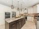 Spacious kitchen with a large center island, stainless steel appliances, and a tile backsplash at 3721 Providence Plantation Ln, Charlotte, NC 28270