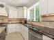Kitchen featuring granite countertops, white cabinetry, and stainless steel appliances at 3721 Providence Plantation Ln, Charlotte, NC 28270