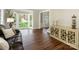 Living room featuring a bay window, hardwood floors, and an entrance way to the foyer at 3721 Providence Plantation Ln, Charlotte, NC 28270