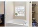 Bright bathroom with a large soaking tub and a window providing natural light at 400 Joe Cloninger Rd, Bessemer City, NC 28016