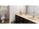 Bathroom features a double vanity with dark cabinets and a framed mirror at 400 Joe Cloninger Rd, Bessemer City, NC 28016