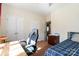 Comfortable bedroom featuring a desk area, neutral walls, and closet with white doors at 400 Joe Cloninger Rd, Bessemer City, NC 28016