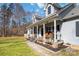 Charming gray home featuring a cozy front porch at 400 Joe Cloninger Rd, Bessemer City, NC 28016