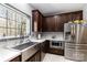 Well-lit kitchen with stainless steel appliances, ample counter space, and wooden cabinets at 400 Joe Cloninger Rd, Bessemer City, NC 28016