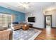 Cozy living room with hardwood floors, comfortable seating, and stylish rug at 400 Joe Cloninger Rd, Bessemer City, NC 28016