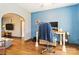 Bright office space with hardwood floors, modern blue accent wall, and comfortable seating at 400 Joe Cloninger Rd, Bessemer City, NC 28016
