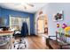 Office space with hardwood floors, natural light, and blue accent wall at 400 Joe Cloninger Rd, Bessemer City, NC 28016