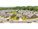 A wide aerial view captures the streetscape with manicured lawns and a community rich in green landscaping at 4069 Havenport Cir, Fort Mill, SC 29708