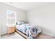 Bright bedroom with a full-sized bed next to a window and a bedside table at 4069 Havenport Cir, Fort Mill, SC 29708