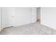 Neutral carpeted bedroom with a large closet, door, and baseboard at 4069 Havenport Cir, Fort Mill, SC 29708