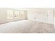 Bright carpeted bonus room with a neutral color scheme and three windows lets in lots of light at 4069 Havenport Cir, Fort Mill, SC 29708