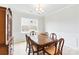 Elegantly appointed dining room with classic furniture, chandelier, and decorative wall paneling at 4069 Havenport Cir, Fort Mill, SC 29708