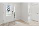 Bright entryway featuring a decorative glass front door and light wood flooring at 4069 Havenport Cir, Fort Mill, SC 29708