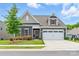 Charming home featuring a manicured lawn, colorful landscaping, and a two-car garage at 4069 Havenport Cir, Fort Mill, SC 29708