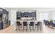 Bright kitchen featuring a large island, stainless appliances, and sleek, dark cabinetry at 4069 Havenport Cir, Fort Mill, SC 29708