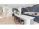 Bright, open kitchen with a large island, stainless steel appliances, and dark blue cabinets at 4069 Havenport Cir, Fort Mill, SC 29708