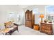 Cozy sitting room with a large armoire, accent chair, and side tables at 4069 Havenport Cir, Fort Mill, SC 29708