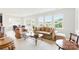 Sun-filled living room with comfortable seating, glass coffee table, and view of the outdoors at 4069 Havenport Cir, Fort Mill, SC 29708