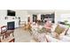 Open concept living room featuring a fireplace, elegant furniture, and seamless access to the kitchen at 4069 Havenport Cir, Fort Mill, SC 29708