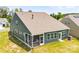 Back of home with a screened in porch, lots of windows, and lovely green yard at 4069 Havenport Cir, Fort Mill, SC 29708