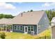 Back of home with a screened in porch, lots of windows, and lovely green yard at 4069 Havenport Cir, Fort Mill, SC 29708