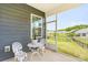 Relaxing screened-in porch with comfortable seating and scenic backyard views at 4069 Havenport Cir, Fort Mill, SC 29708