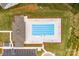 A refreshing aerial view of a pristine community pool and lounging area, meticulously kept and ready for relaxation at 4069 Havenport Cir, Tega Cay, SC 29708
