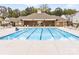 The expansive community pool has numerous lounge chairs for residents to soak up the sun by the sparkling water at 4069 Havenport Cir, Tega Cay, SC 29708