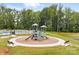 A colorful community playground with slides and climbing structures, set against a backdrop of mature trees at 4069 Havenport Cir, Tega Cay, SC 29708