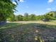 Expansive backyard with lush greenery, offering ample space and serenity at 4101 New Castle Ln, Monroe, NC 28110