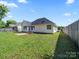 Well-kept backyard, including a patio and privacy fence at 4101 New Castle Ln, Monroe, NC 28110