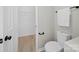This updated bathroom features a new toilet and walk in closet for extra storage space at 4101 New Castle Ln, Monroe, NC 28110