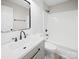 Clean bathroom featuring modern fixtures, white shiplap walls, and a shower-tub combo at 4101 New Castle Ln, Monroe, NC 28110