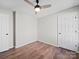 This bedroom features neutral walls, wood floors and a modern ceiling fan at 4101 New Castle Ln, Monroe, NC 28110