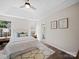Inviting bedroom features a trey ceiling, ceiling fan, and ensuite bathroom access at 4101 New Castle Ln, Monroe, NC 28110