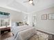 Comfortable bedroom showcasing wood floors, a ceiling fan, and plenty of natural light at 4101 New Castle Ln, Monroe, NC 28110